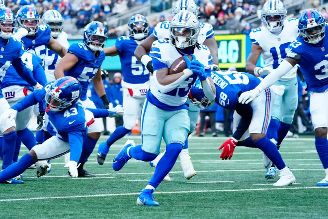 Dallas Cowboys running back Jaydon Blue (23) scores the first touchdown of the game, Sunday, January 4, 2026, in East Rutherford.