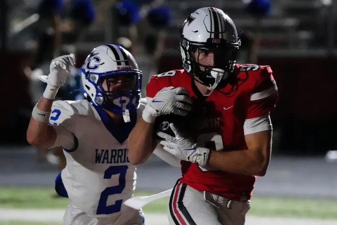 North Oconee wide receiver Dallas Dickerson (9) drives in for a touchdown