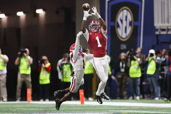 Dec 6, 2025; Atlanta, GA, USA; Alabama Crimson Tide wide receiver Isaiah Horton (1) attempts to make a catch as Georgia Bulldogs defensive back Ellis Robinson IV (1) defends during the second quarter during the 2025 SEC Championship game at Mercedes-Benz Stadium.