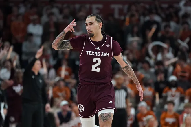 Jan 17, 2026; Austin, Texas, USA; Texas A&M Aggies guard Pop Isaacs (2) reacts to a three point basket against the Texas Longhorns during the second half at Moody Center. Mandatory Credit: Dustin Safranek-Imagn Images