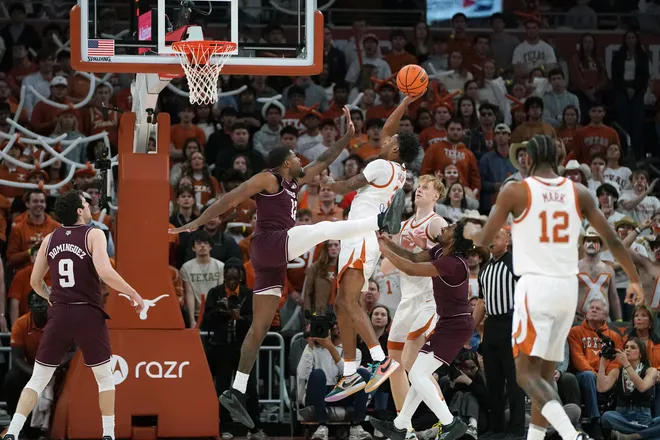 Jan 17, 2026; Austin, Texas, USA; Texas Longhorns guard Dailyn Swain (3) takes a jump shot against Texas A&M Aggies forward Rashaun Agee (12) during the first half at Moody Center. Mandatory Credit: Dustin Safranek-Imagn Images