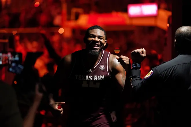 Jan 17, 2026; Austin, Texas, USA; Texas A&M Aggies forward Rashaun Agee (12) celebrates a 74-70 win against the Texas Longhorns after the game at Moody Center. Mandatory Credit: Dustin Safranek-Imagn Images