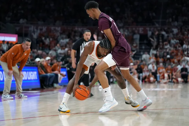 Jan 17, 2026; Austin, Texas, USA; Texas Longhorns guard Tramon Mark (12) moves against Texas A&M Aggies guard Ryan Griffen (3) during the second half at Moody Center. Mandatory Credit: Dustin Safranek-Imagn Images