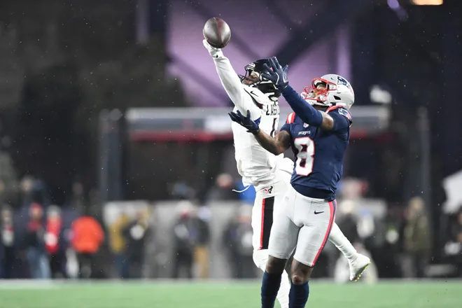 Jan 18, 2026; Foxborough, MA, USA; Houston Texans cornerback Kamari Lassiter (4) blocks a pass intended for New England Patriots wide receiver Stefon Diggs (8) in the third quarter in an AFC Divisional Round game at Gillette Stadium. Mandatory Credit: Brian Fluharty-Imagn Images