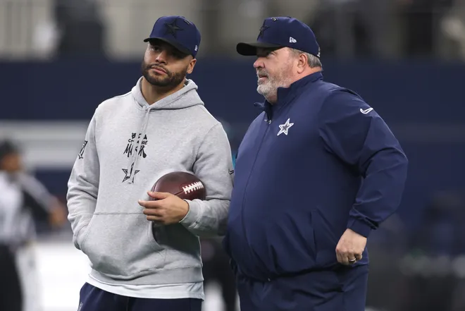 Jan 5, 2025; Arlington, Texas, USA; Dallas Cowboys quarterback Dak Prescott (4) talks to head coach Mike McCarthy before the game against the Washington Commanders at AT&T Stadium. Mandatory Credit: Tim Heitman-Imagn Images