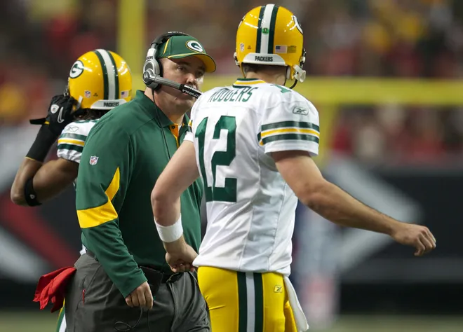 Nov 28, 2010; Atlanta, GA, USA; Green Bay Packers head coach Mike McCarthy talks to quarterback Aaron Rodgers (12) on the sideline during the game against the Atlanta Falcons at the Georgia Dome. The Falcons defeated the Packers 20-17. Mandatory Credit: Dale Zanine-USA TODAY Sports