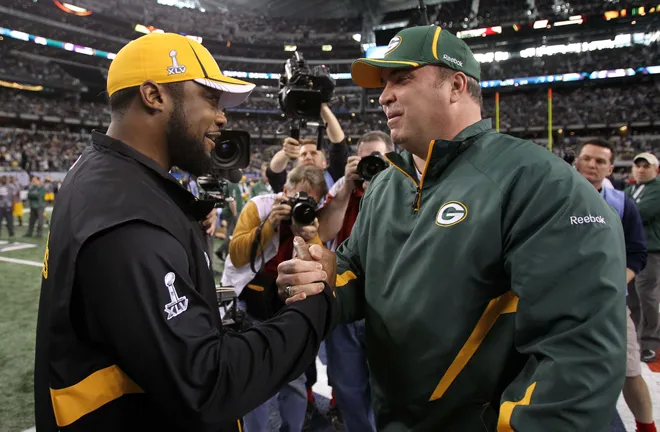 Feb 6, 2011; Arlington, TX, USA; Green Bay Packers head coach Mike McCarthy (right) greets Pittsburgh Steelers head coach Mike Tomlin before Super Bowl XLV at Cowboys Stadium. Mandatory Credit: Matthew Emmons-USA TODAY Sports