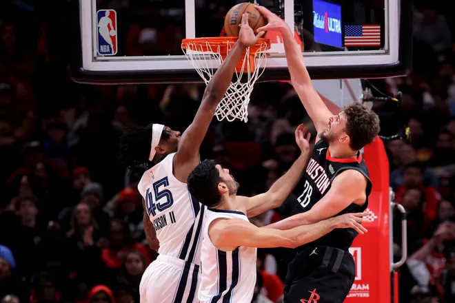 Jan 26, 2026; Houston, Texas, USA; Houston Rockets center Alperen Sengun (28) dunks against Memphis Grizzlies forward GG Jackson (45) during the fourth quarter at Toyota Center. Mandatory Credit: Erik Williams-Imagn Images
