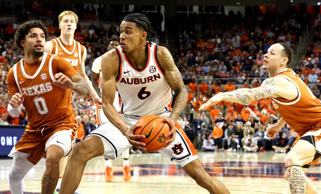 Jan 28, 2026; Auburn, Alabama, USA; Auburn Tigers guard Elyjah Freeman (6) moves in for a shot against the Texas Longhorns during the second half at Neville Arena. Mandatory Credit: John Reed-Imagn Images