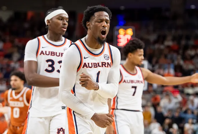 Auburn Tigers guard Kevin Overton (1) disputes a foul call as Auburn Tigers take on Texas Longhorns at Neville Arena in Auburn, Ala. on Wednesday, Jan. 28, 2026. Texas Longhorns leads Auburn Tigers 42-34.