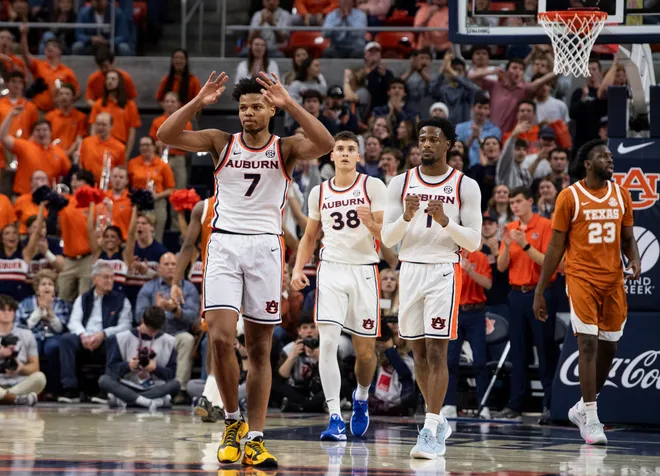 Auburn Tigers forward Keyshawn Hall (7) celebrates his and-one three-pointer as Auburn Tigers take on Texas Longhorns at Neville Arena in Auburn, Ala. on Wednesday, Jan. 28, 2026. Texas Longhorns leads Auburn Tigers 42-34.