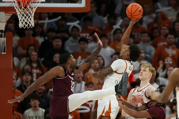 AUSTIN, TX – JANUARY 17: Forward Dailyn Swain #3 of the Texas Longhorns takes a one-handed shot over forward Rashaun Agee #12 of the Texas A&M Aggies during the SEC college basketball game between Texas Longhorns and Texas A&M Aggies on January 17, 2026, at Moody Center in Austin, TX. (Photo by David Buono/Icon Sportswire via Getty Images)