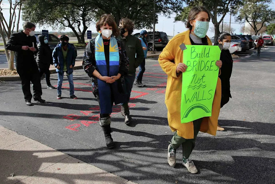 Allies of immigrants taking sanctuary at Austin churches, which include a coalition of 25 church congregations and social justice groups walk toward the ICE Enforcement and Removal Operations office on Thursday, Jan. 28, 2021. The grouped traveled via caravan to San Antonio to rally in front of ICE San Antonio field office in support of Biden's executive order reversing Trump's zero tolerance policy of rejecting stays of removal. In particular, the group, Austin Sanctuary Network, was rallying for Guatemalan refugee Hilda Ramirez and her son Ivan and El Salvadoran Alirio Gamez so that they may finally leave the churches' grounds to walk without fear. Their attempt to get clarification of new presidential executive orders regarding immigration and the turning over signatures to plead for the immigrant's cases to be reviewed were denied by ICE officials. Supporters remained hopeful that something would be done for all refugees and immigrants in similar situations. (Kin Man Hui, San Antonio Express-News / Staff photographer)