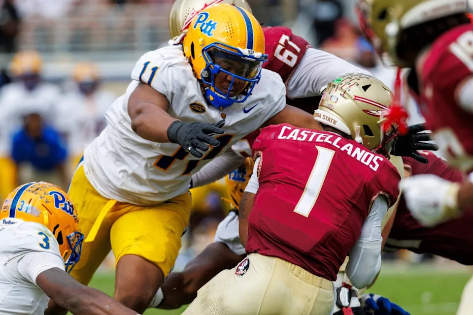 Florida State quarterback Tommy Castellanos (1) is tackled by Pittsburgh linebacker Rasheem Biles (3) and defensive lineman Nick James (11) during the second half of an NCAA college football game, Saturday, Oct. 11, 2025, in Tallahassee, Fla. (AP Photo/Colin Hackley)