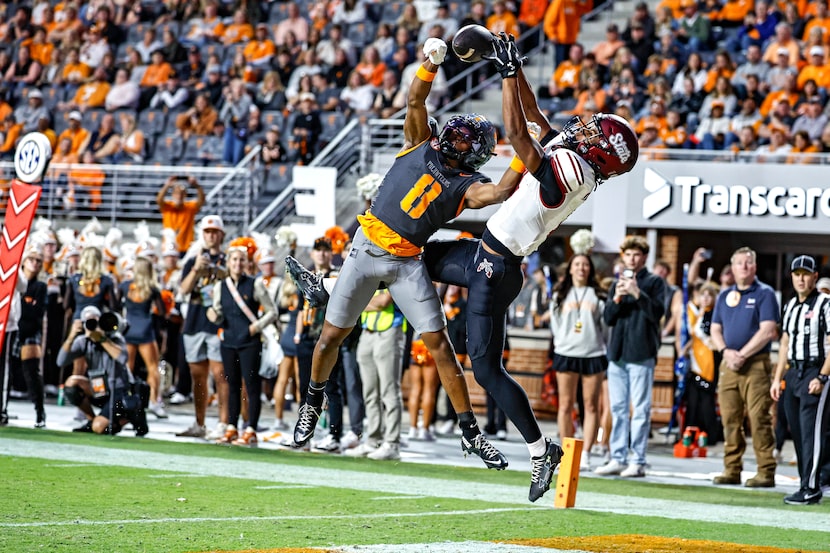 Tennessee defensive back Colton Hood (8) breaks up a pass intended for New Mexico State...