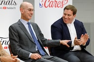 NBA Commissioner Adam Silver (left) acknowledges Dallas Mavericks governor Patrick Dumont...