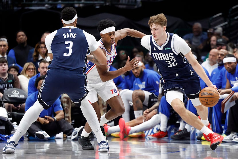Dallas Mavericks forward Cooper Flagg (32) dribbles past the pick set by forward Anthony...