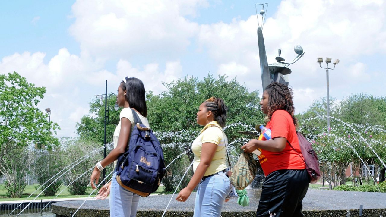 Students walk around the campus of Texas Southern University Wednesday, July 9, 2008 in Houston. (AP Photo/Pat Sullivan)