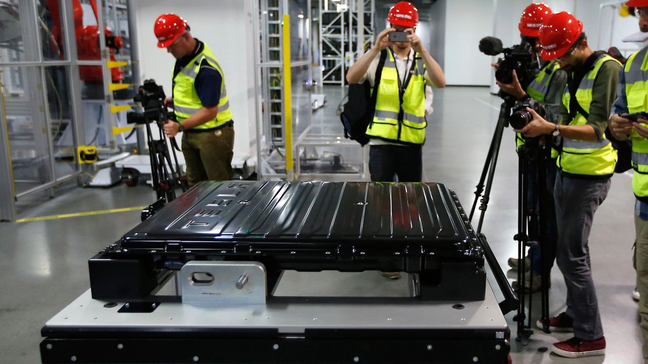 A Tesla battery pack is displayed during a media tour of the new Tesla Motors Inc., Gigafactory Tuesday, July 26, 2016, in Sparks, Nev.. (AP Photo/Rich Pedroncelli)