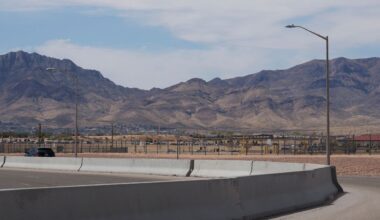 The Franklin Mountains loom over Fort Bliss, a vast military installation in the desert on the outskirts of El Paso where an emergency shelter houses teens who crossed the U.S.-Mexican border without parents or guardians, on Sunday, April 3, 2022. (AP Photo/Giovanna Dell'Orto)