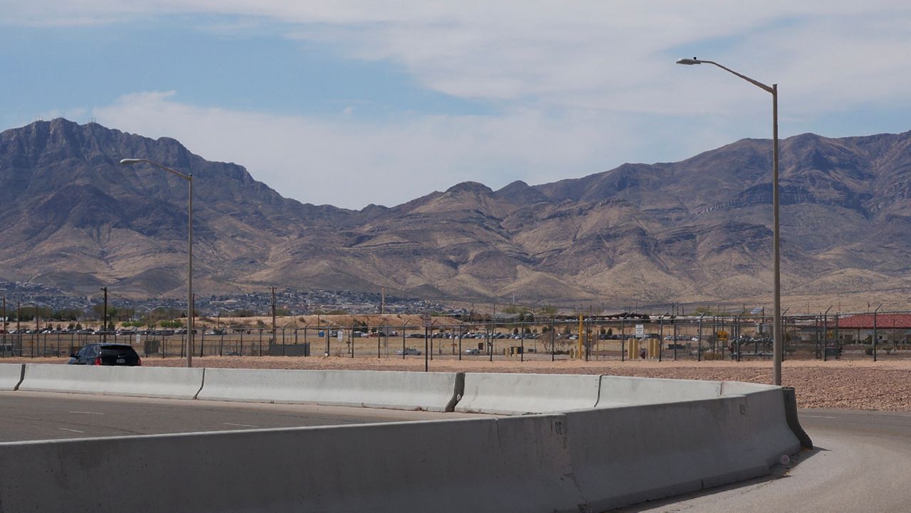 The Franklin Mountains loom over Fort Bliss, a vast military installation in the desert on the outskirts of El Paso where an emergency shelter houses teens who crossed the U.S.-Mexican border without parents or guardians, on Sunday, April 3, 2022. (AP Photo/Giovanna Dell'Orto)