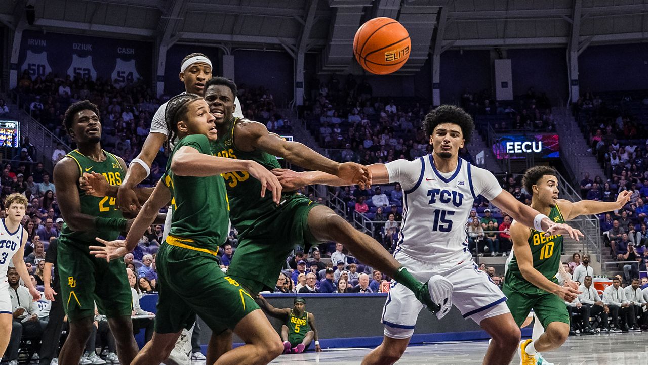 Baylor guard Cameron Carr (43), Baylor center James Nnaji (50), and TCU forward David Punch (15) look to rebound the ball during an NCAA college basketball game, Saturday, Jan. 3, 2026, Fort Worth, Texas. (AP Photo/Jessica Tobias)
