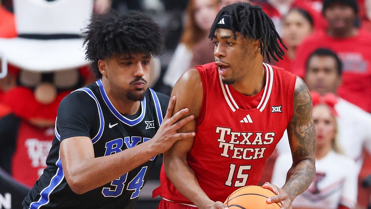 Texas Tech forward JT Toppin (15) drives to the hoop against BYU forward Abdullah Ahmed (34) during the first half of an NCAA college basketball game Saturday, Jan. 17, 2026, in Lubbock, Texas. (AP Photo/Chase Seabolt)