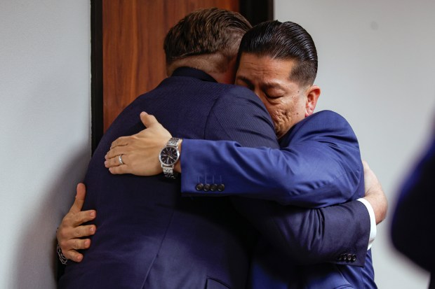 Former Uvalde school district police officer Adrian Gonzales, right, embraces his attorney Jason Goss after the jury found Gonzales not guilty at the Nueces County Courthouse on Wednesday, Jan. 21, 2026, in Corpus Christi, Texas.