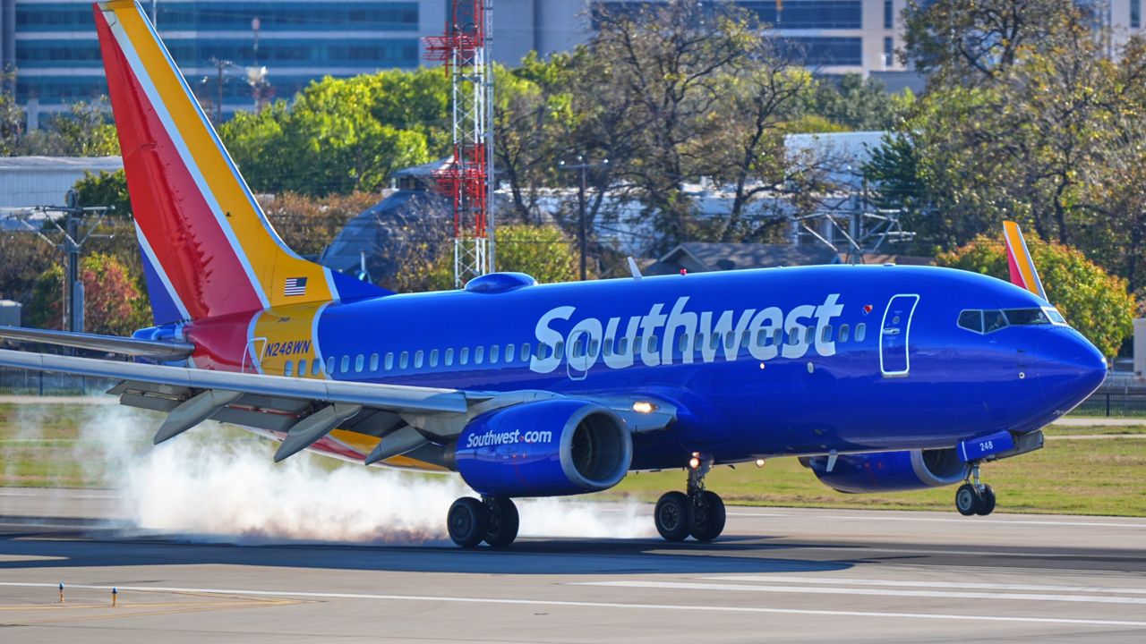A Southwest Airlines plane lands at Love Field Airport, Nov. 26, 2025, in Dallas. (AP Photo/LM Otero)