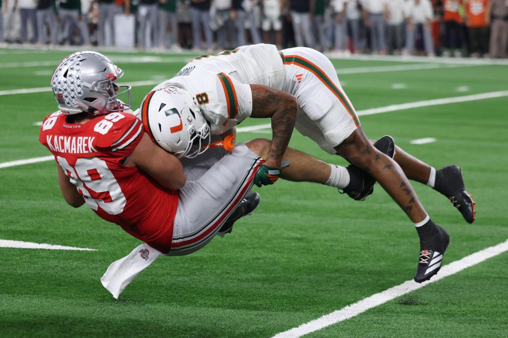 Another CFP bye bites the dust as defending champ Ohio State falls to Miami – The Mercury News