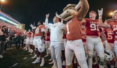 Texas coach Steve Sarkisian sings "The Eyes of Texas" with team the Bevo mascot after an NCAA college football game against Texas Tech, Friday, Nov. 24, 2023, in Austin, Texas. (AP Photo/Michael Thomas)