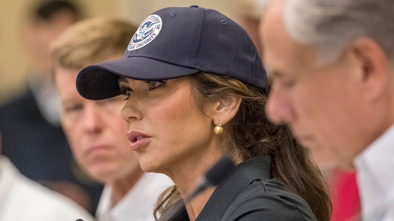 Homeland Security Secretary Kristi Noem, center, and Texas Gov. Greg Abbott, right, discuss the ongoing search and rescue efforts after recent flooding along the Guadalupe River during a press conference on Saturday, July 5, 2025, in Kerrville, Texas. (AP Photo/Rodolfo Gonzalez)
