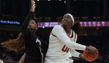 Texas center Kyla Oldacre (00) looks to shoot past Texas A&M center Emerald Parker (24) during the second half of an NCAA college basketball game in Austin, Texas, Sunday, Jan. 18, 2026. (AP Photo/Eric Gay)