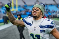 Seattle Seahawks wide receiver Jaxon Smith-Njigba (11) walks off the field after defeating...