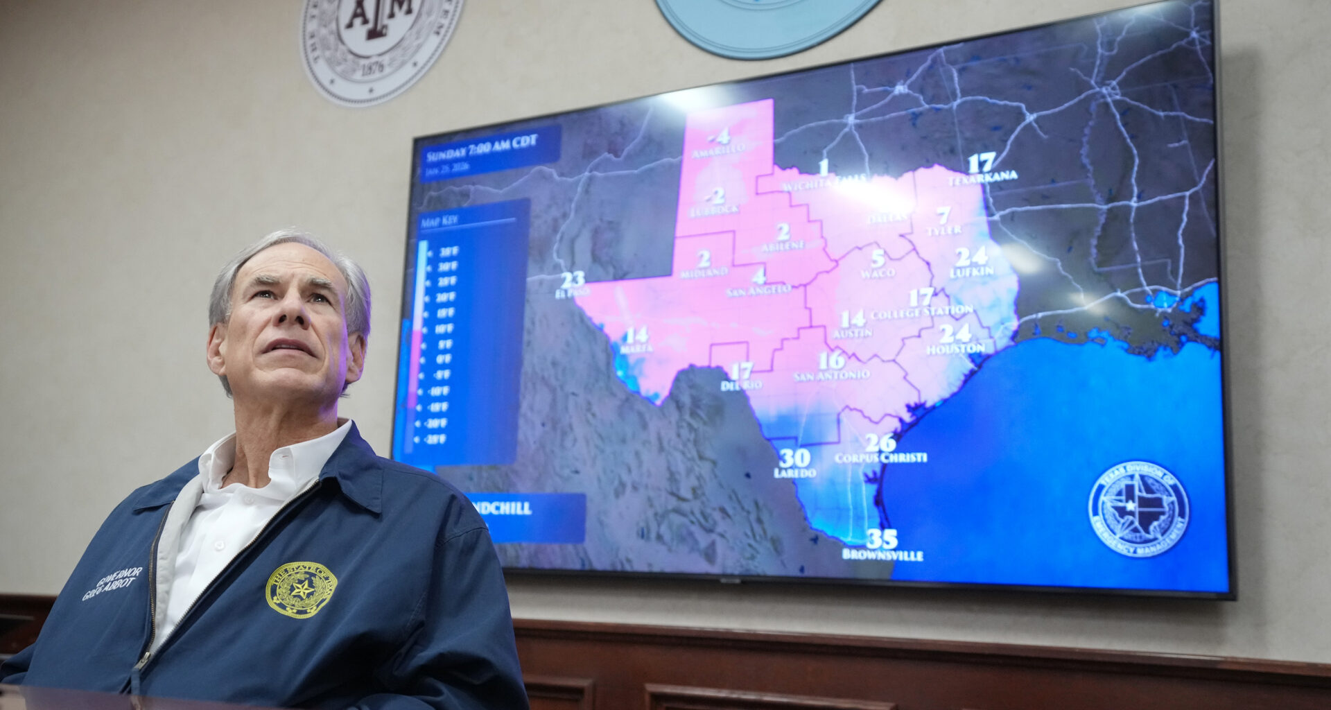 Texas Gov. Greg Abbott listens to a briefing as he prepares for a winter storm at the State Operations Center in Austin. Credit: Jay Janner/The Austin American-Statesman via Getty Images