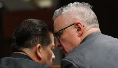 Former Uvalde school district police officer Adrian Gonzales talks with defense attorney Gary Hillier during the seventh day of Gonzales' trial at the Nueces County Courthouse in Corpus Christi, Texas, Wednesday, Jan. 14, 2026. (Sam Owens/The San Antonio Express-News via AP, Pool)
