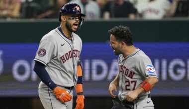 Houston Astros' Carlos Correa, left, and Jose Altuve (27) celebrate after Correa hit a two-run home run that scored Altuve in the eighth inning of a baseball game against the Texas Rangers Friday, Sept. 5, 2025, in Arlington, Texas. (AP Photo/Tony Gutierrez)
