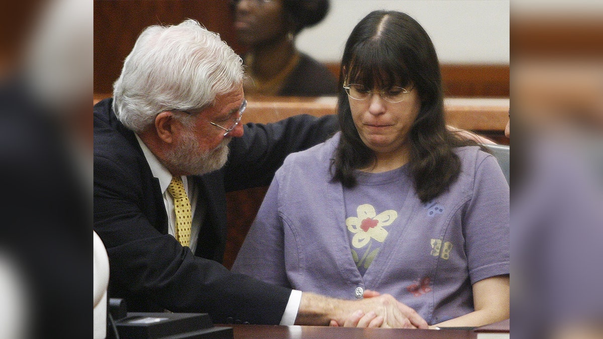 Andrea Yates, right, sits with her attorney George Parnham after the not guilty by reason of insanity verdict was read in her retrial July 26, 2006, in Houston.