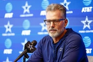 Dallas Cowboys defensive coordinator Matt Eberflus speaks with reporters before a practice...