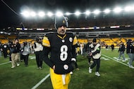 Pittsburgh Steelers quarterback Aaron Rodgers (8) leaves the field after an NFL wild-card...