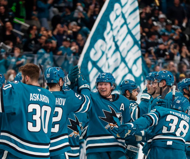 The San Jose Sharks celebrate after San Jose Sharks' Tyler Toffoli (73) scores the game winning goal against Dallas Stars during overtime at SAP Center in San Jose, Calif., on Saturday, Jan. 10, 2026. (Shae Hammond/Bay Area News Group)