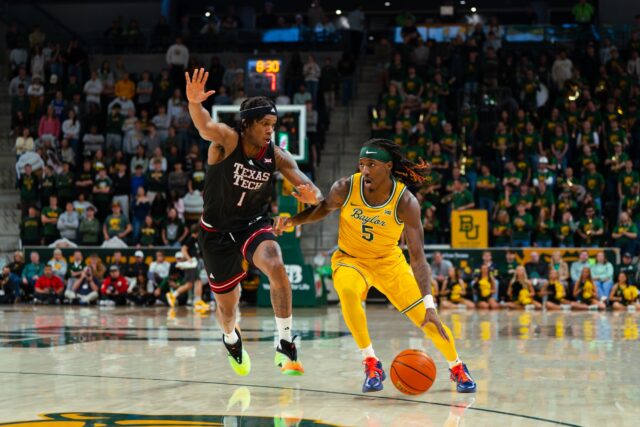 5th year senior guard Obi Agbim drives past a Texas Tech defender on his way to the basket. Brady Harris | Photographer