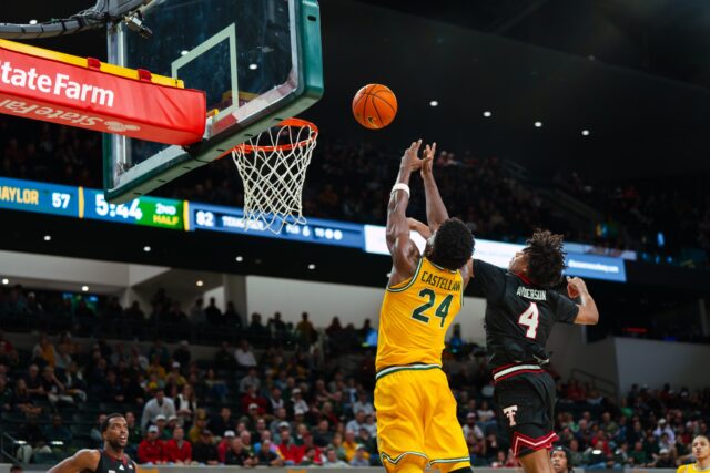 Freshman guard Tounde Yessoufou leaps under the basket for an attempted alley-oop. Brady Harris | Photographer