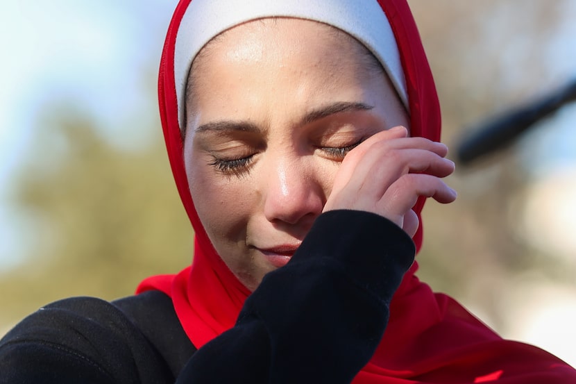 Shahd Arnaout, Maher Tarabish’s daughter-in-law, wipes her tears at a news conference...