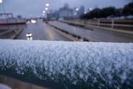 Frost seen on a guardrail over North Central Expressway after the region was blasted with...