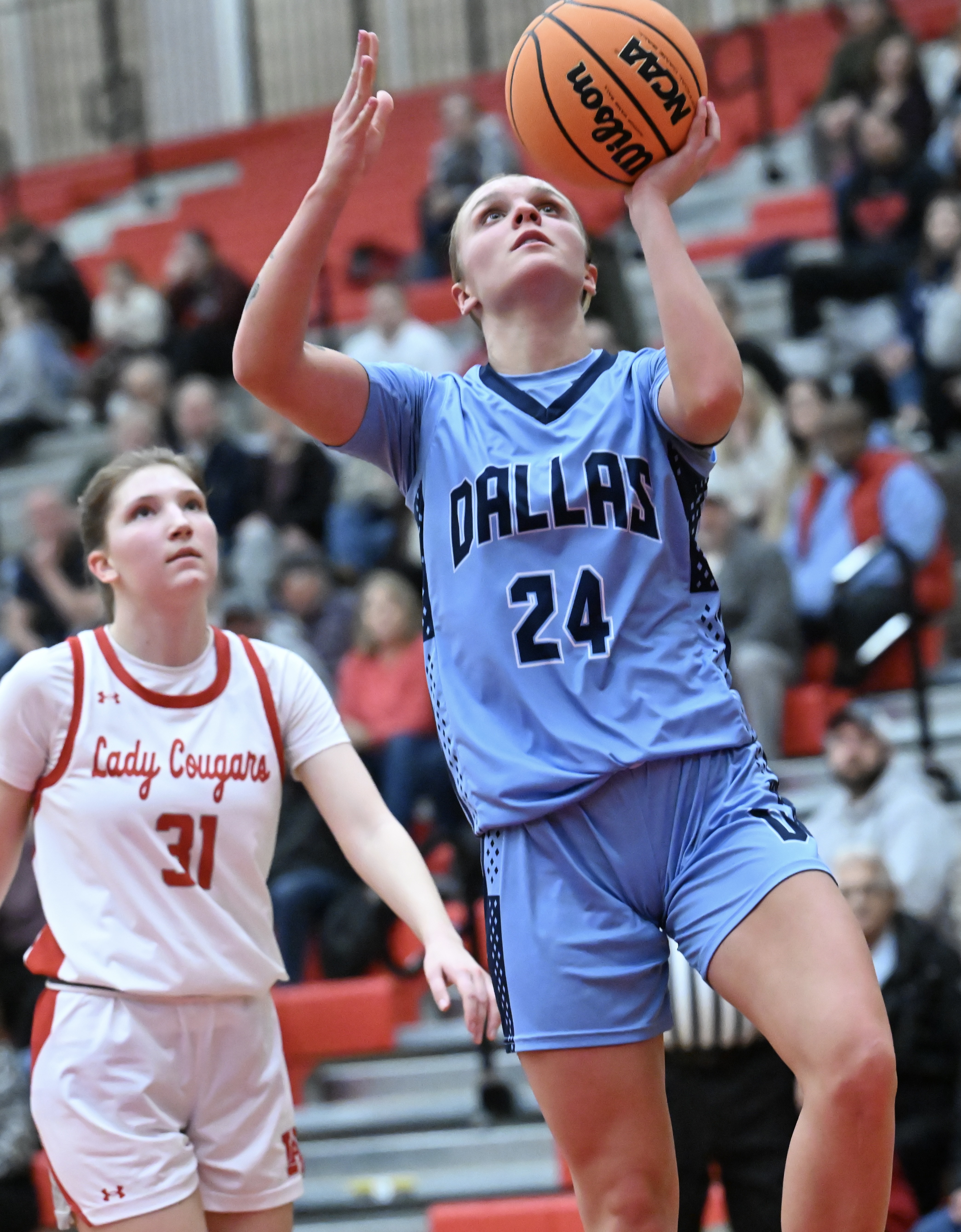 Dallas’ Molly Walsh scores two of her game-high 29 points...