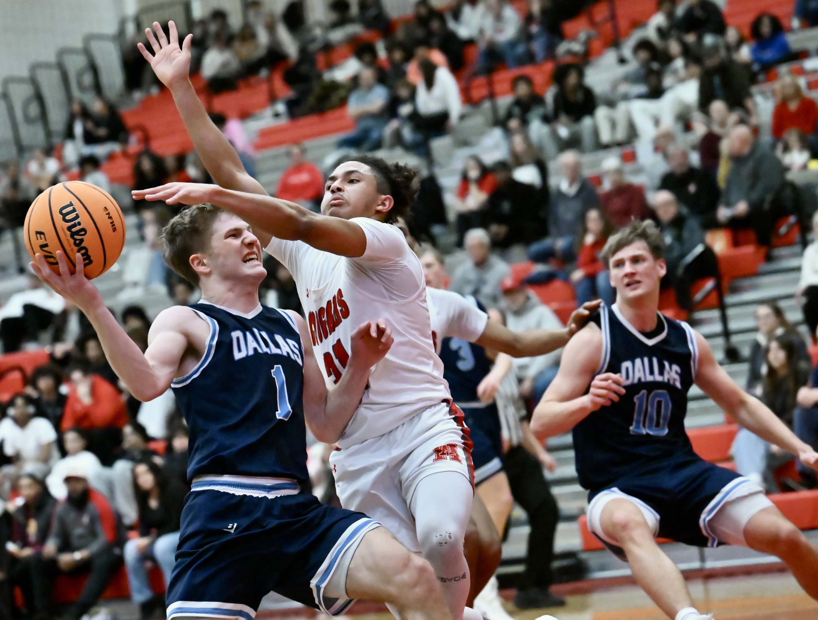 Hazleton Area’s Xavier Heck (31) fouls Dallas’ Joey Nocito on...