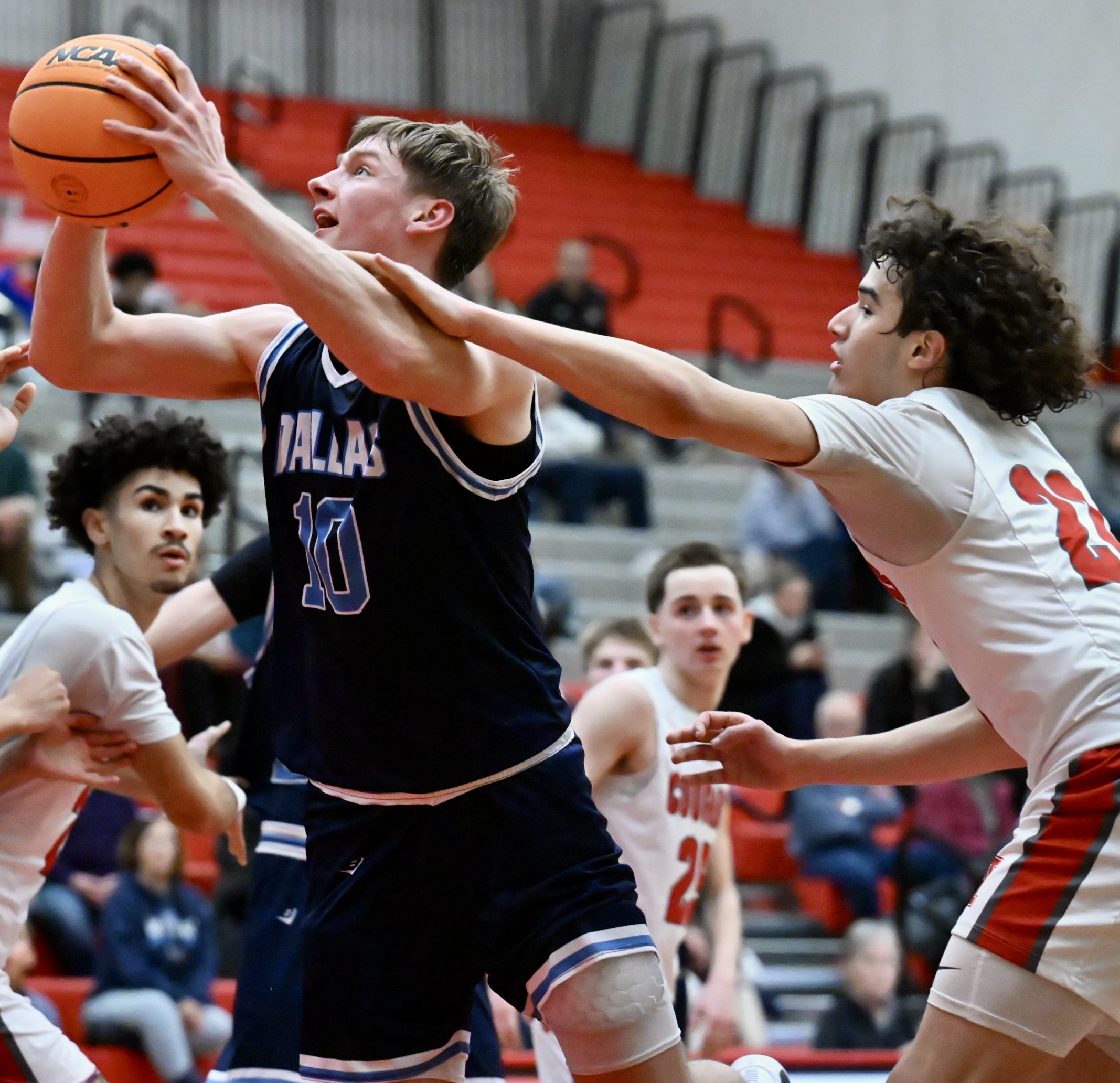 Hazleton Area’s Kendrick Ortiz fouls Dallas’ Pat Flanagan during their...