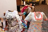 Patron Ana Pena looks through fabrics at the fiber arts workroom on Wednesday, Oct. 22,...