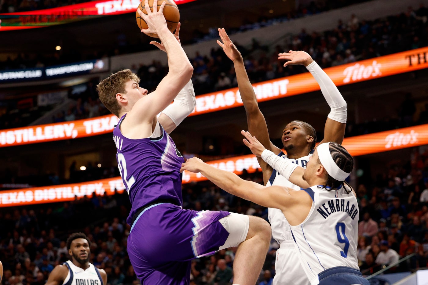 Utah Jazz forward Kyle Filipowski (22) tries to shoot as Dallas Mavericks guard Miles Kelly...